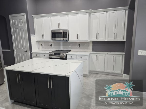  A spacious room with dual sinks and a wide mirror, showcasing a clean and contemporary design.