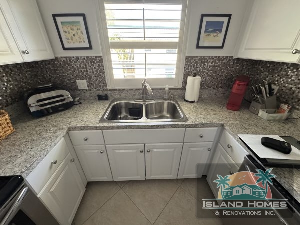 Additional photo of a property listing in Island Home, Florida, showcasing the exterior and surrounding landscape.